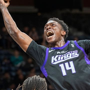 The Stockton Kings' Stanley Johnson, right, drives on Santa Cruz Warriors' Yuri Collins during an NBA G League playoff game at the Adventist Health arena in downtown Stockton on Apr. 4, 2024.