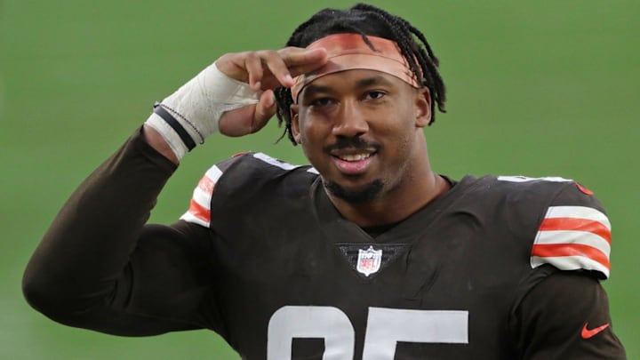Cleveland Browns defensive end Myles Garrett (95) salutes the fans on his way back to the locker room after an NFL football game against the Houston Texans, Sunday, Nov. 15, 2020, in Cleveland, Ohio. [Jeff Lange/Beacon Journal]