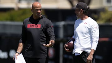 May 9, 2025; Santa Clara, CA, USA; San Francisco 49ers head coach Kyle Shanahan, right, confers with defensive coordinator Robert Saleh during the teamís rookie minicamp.