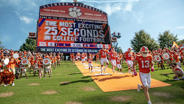 The Clemson football team runs down the hill, dubbed as the most exciting 25 seconds in college football, before the game against Syracuse in Clemson, South Carolina Saturday, Oct 24, 2020.