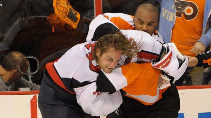 Nov 1, 2013; Philadelphia, PA, USA; Philadelphia Flyers goalie Ray Emery (29) fights Washington Capitals goalie Braden Holtby (70) during the third period at Wells Fargo Center. The Capitals defeated the Flyers, 7-0. Mandatory Credit: Eric Hartline-Imagn Images