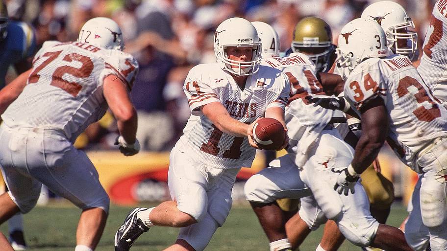 Texas QB Major Applewhite handing off to teammate Ricky Williams against UCLA.