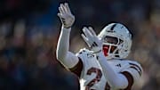 Mississippi State's running back Davon Booth (21) celebrates a touchdown during the Egg Bowl game against Mississippi at Vaught-Hemingway Stadium on Friday, Nov. 29, 2024.