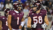 Sep 13, 2025; Blacksburg, Va.; Virginia Tech quarterback Kyron Drones (1) and offensive lineman Tommy Ricard (58) during the second quarter.