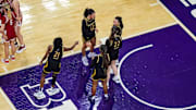 Northwestern Wildcats women's basketball players huddle during a game against the Nebraska Cornhuskers on March 2, 2025.