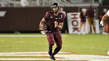 Sep 6, 2025; Blacksburg, Virginia, USA;  Virginia Tech Hokies quarterback Kyron Drones (1) runs the ball during the second quarter at Lane Stadium. Mandatory Credit: Brian Bishop-Imagn Images