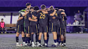 Northwestern Men's Soccer huddles up.