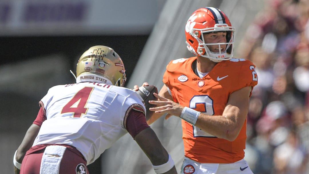 Sep 23, 2023; Clemson, South Carolina, USA; Florida State Seminoles linebacker Karen DeLoach (4) hits Clemson Tigers quarterback Cade Klubnik (2) To knock the ball loose before picking up the fumble and returning it for a touchdown during the third quarter at Memorial Stadium. Mandatory Credit: Ken Ruinard-USA TODAY Sports