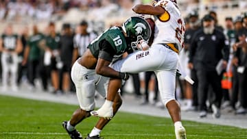 Michigan State's Armorion Smith, left, tackles Central Michigan's DeAnthony Becton during the second quarter on Friday, Sept. 1, 2023, at Spartan Stadium in East Lansing.