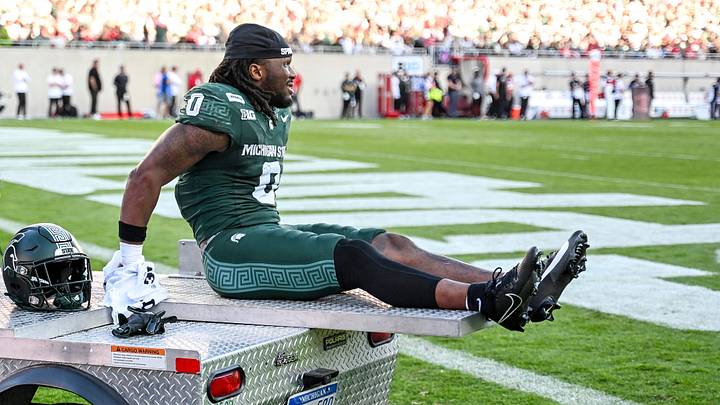 Michigan State’s Cam Edwards leaves the field on a cart after suffering an injury against Nebraska during the first quarter on Saturday, Sept. 26, 2026, in East Lansing.