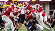 Indiana defense tackles during the Indiana versus Michigan football game at Memorial Stadium on Friday, Nov. 9, 2024.
