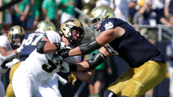 Notre Dame offensive lineman Tosh Baker (79) blocks Purdue defensive end George Karlaftis (5) during ND's 27-13 win over Purdue, Saturday, Sept. 18, 2021, at Notre Dame Stadium.

Cfb Notre Dame Vs Purdue