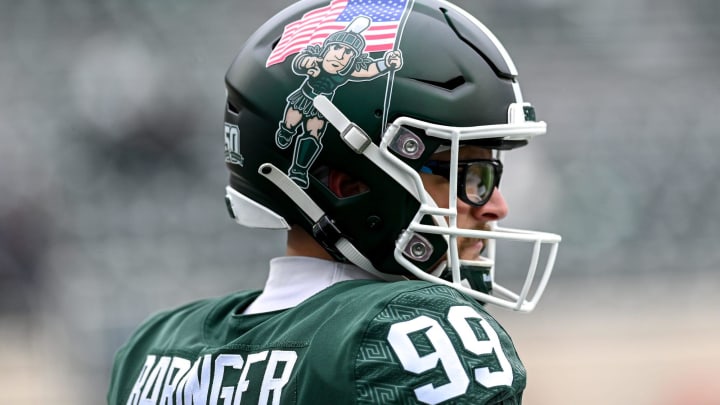 Sporting a helmet featuring Sparty carrying a flag, Michigan State's Bryce Baringer looks on before the football game against Rutgers on Saturday, Nov. 12, 2022, in East Lansing.

221112 Msu Rutgers Fb 025a