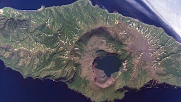 The Zavaritskii Caldera on Simushir Island, the site of a climate-altering 1831 volcanic eruption, as seen from the International Space Station.