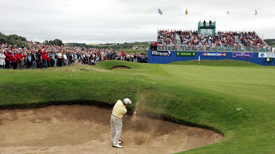 American Pete Oakley chips out of the bunker at the 18th hole before winning the 2004 Senior British Open Championship.