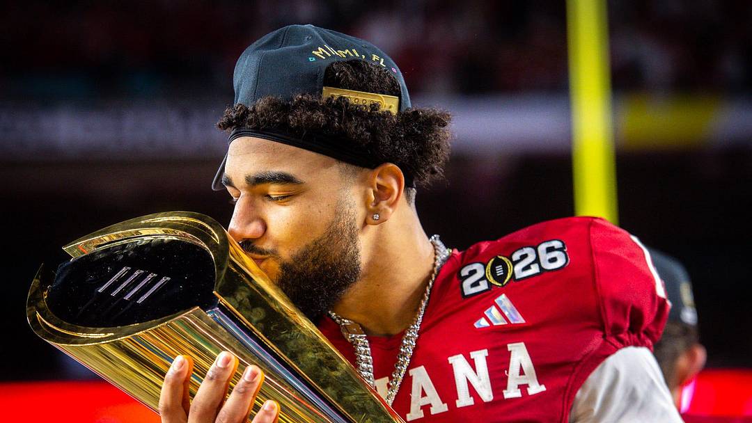 Indiana's Elijah Sarratt (13) kisses the trophy after the College Football Playoff National Championship college football game at Hard Rock Stadium in Miami Gardens on Monday, Jan. 19, 2026.