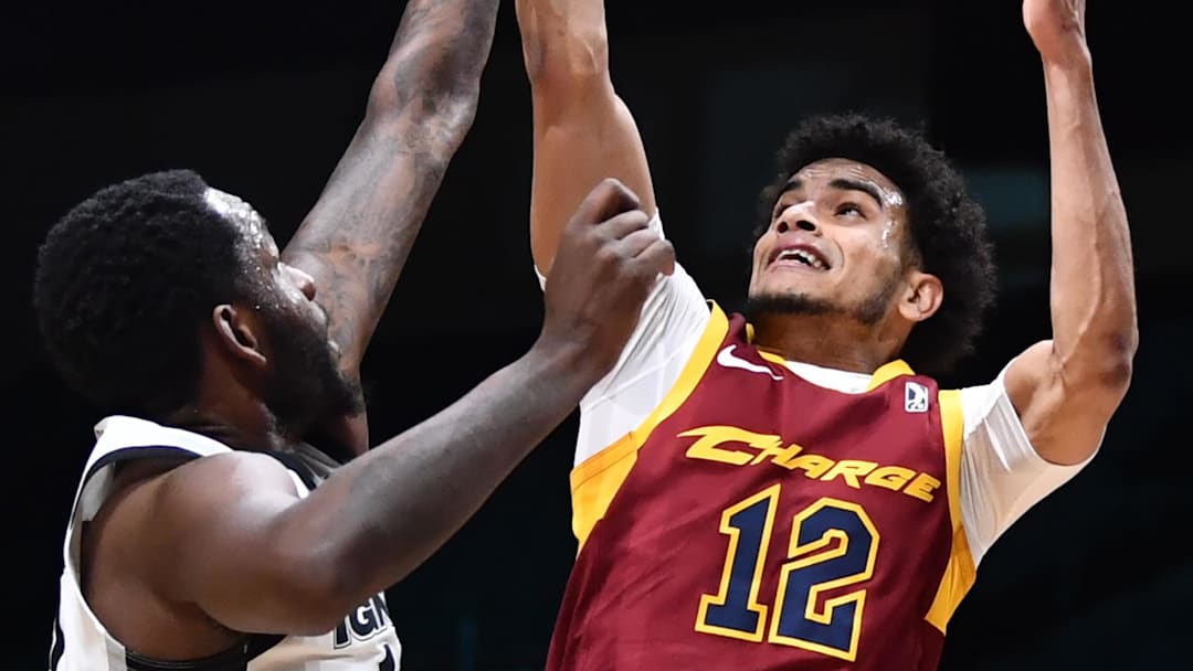 Feb 20, 2022; Cleveland, OH, USA; Cleveland Charge forward Justin James (12) blocks the shot of G League Ignite guard Pooh Jeter (5) during the second half of the NBA G League Next Gem Game at the Wolstein Center. Mandatory Credit: Ken Blaze-Imagn Images Feb 20, 2022; Cleveland, OH, USA; Cleveland Charge forward Justin James (12) blocks the shot of G League Ignite guard Pooh Jeter (5) during the second half of the NBA G League Next Gem Game at the Wolstein Center. Mandatory Credit: Ken Blaze-Imagn Images
