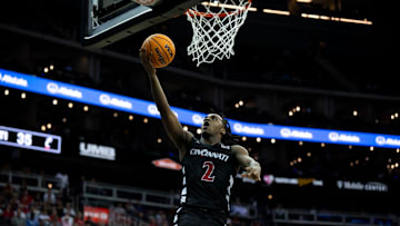 Cincinnati Bearcats guard Jizzle James (2) hits a layup in the second half of the Big 12 Conference tournament game between Cincinnati Bearcats and Baylor Bears at T-Mobile Center in Kansas City, Mo., on Thursday, March 14, 2024.