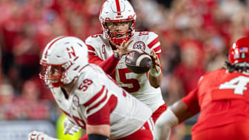Nebraska quarterback Dylan Raiola takes snap while offensive lineman Henry Lutovsky prepares to protect against Cincinnati in Kansas City.