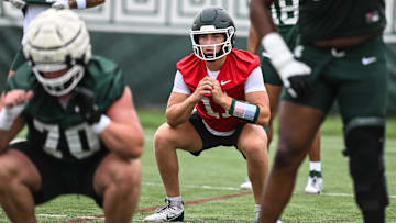 MSU QB Alessio Milivojevic and teammates warm up, Tuesday, July 29, 2025, during the first day of football practice at the Skandalaris Football Center.