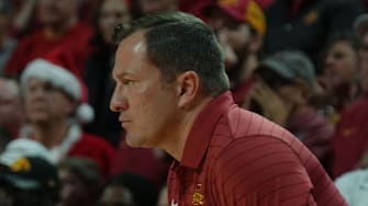 Iowa State Cyclones men's basketball head coach T.J. Otzelberger watches from bench against Iowa during the first half in the men’s basketball Cy-Hawk series on Dec. 11, 2025, in Ames, Iowa.