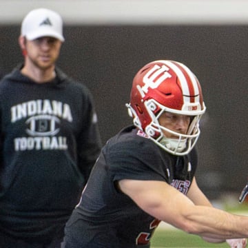 Indiana football quarterbacks coach Chandler Whitmer eyes a drill during spring football practice on Tuesday, April 8, 2025.