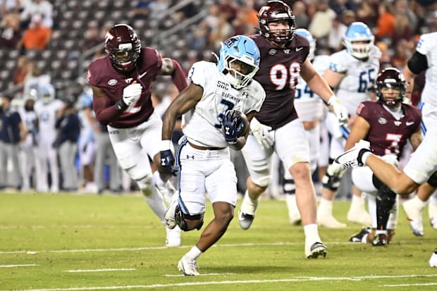 Old Dominion running back Devin Roche runs for a touchdown against Virginia Tech.