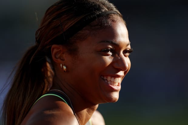 U.S. Olympic sprinter Gabby Thomas smiles.