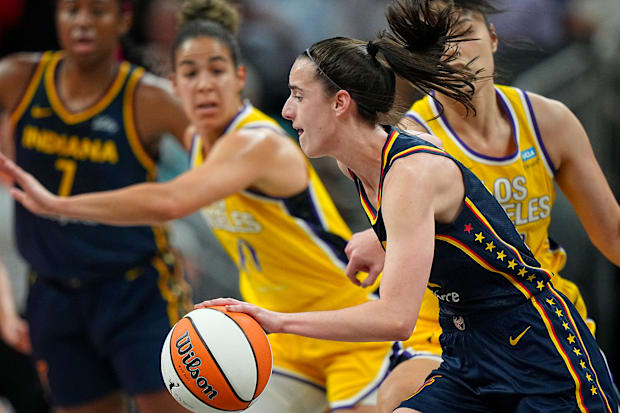 Indiana Fever guard Caitlin Clark drives the ball against the Los Angeles Sparks. 