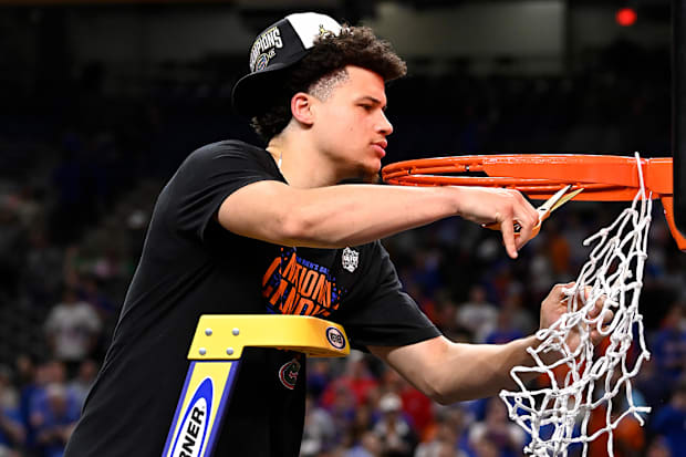 Florida's Walter Clayton Jr. cuts down one of the nets.
