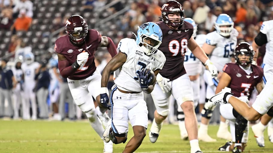 Old Dominion running back Devin Roche runs for a touchdown against Virginia Tech.