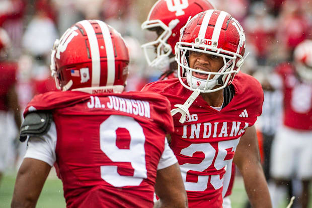 Amare Ferrell (25) and Jamier Johnson celebrate a stop against Maryland.