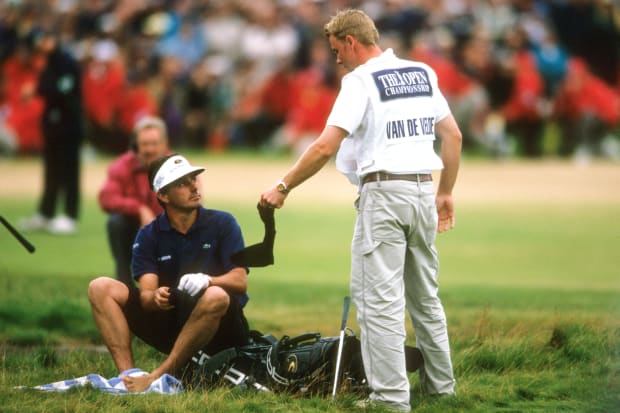 Jean Van de Velde puts his socks back on at the 1999 British Open.