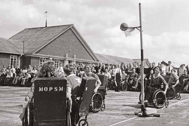 Athletes in wheelchairs compete in netball during the early Stoke Mandeville games in England. 