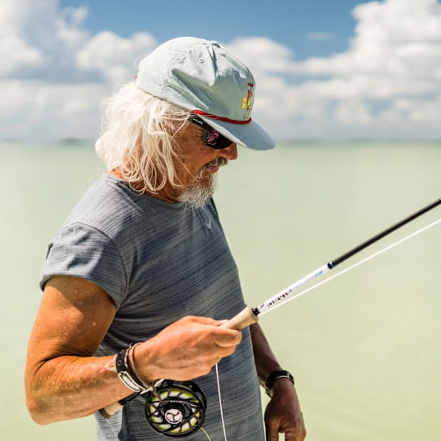 CEO and founder Al Perkinson of Bajio sunglasses fly fishing a shallow water flat in Florida.