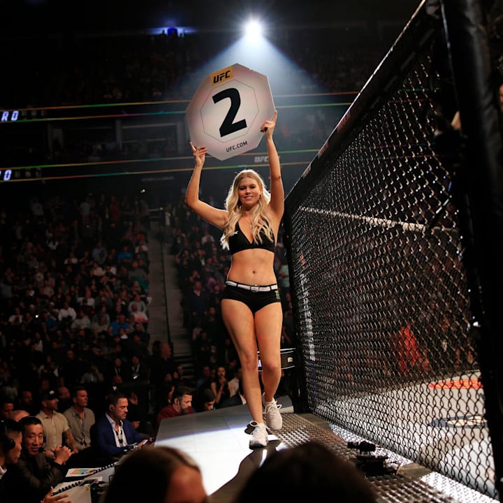 A ring girl holds up a second round card during the Gilbert Burns vs. Khamzat Chimaev fight 