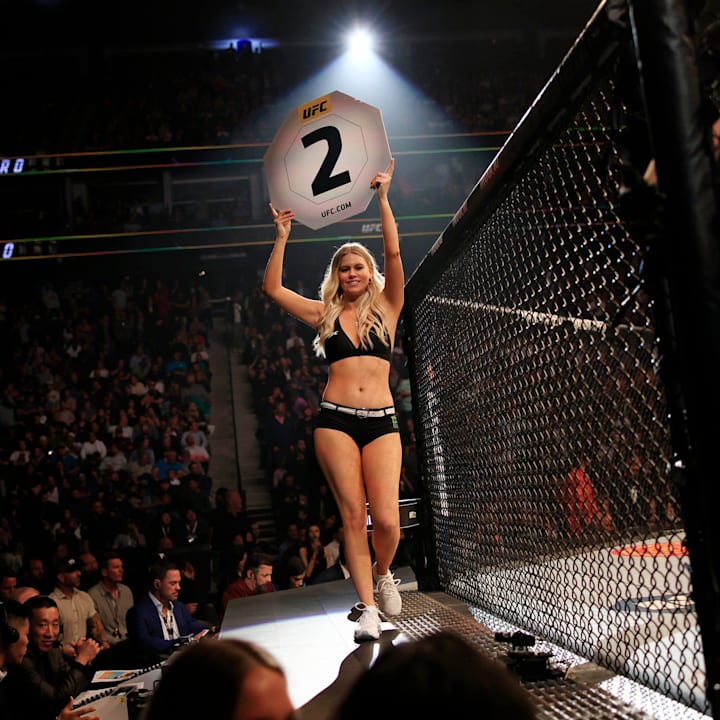 A ring girl holds up a second round card during the Gilbert Burns vs. Khamzat Chimaev fight during UFC 273 