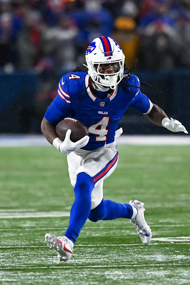 Buffalo Bills running back James Cook runs with the ball in the fourth quarter of a AFC divisional round game Buffalo Bills running back James Cook runs with the ball in the fourth quarter of a AFC divisional round game