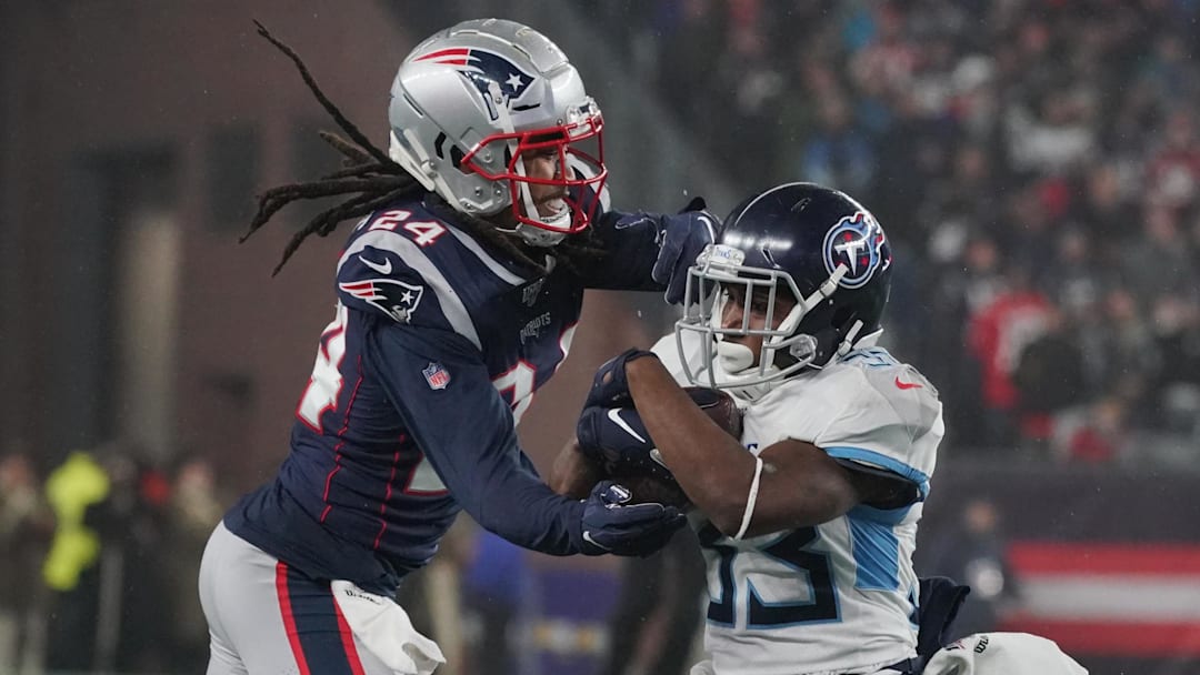 Jan 4, 2020; Foxborough, Massachusetts, USA; Tennessee Titans running back Dion Lewis (33) runs the ball against New England Patriots cornerback Stephon Gilmore (24) at Gillette Stadium. Mandatory Credit: David Butler II-Imagn Images Jan 4, 2020; Foxborough, Massachusetts, USA; Tennessee Titans running back Dion Lewis (33) runs the ball against New England Patriots cornerback Stephon Gilmore (24) at Gillette Stadium. Mandatory Credit: David Butler II-Imagn Images