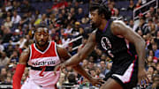 Dec 18, 2016; Washington, DC, USA; Washington Wizards guard John Wall (2) dribbles the ball as LA Clippers center DeAndre Jordan (6) defends in the third quarter at Verizon Center. The Wizards won 117-110. Mandatory Credit: Geoff Burke-Imagn Images