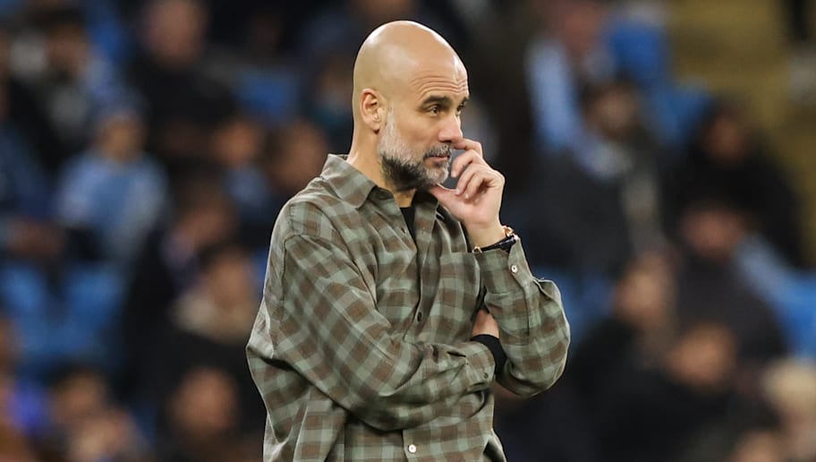Pep Guardiola looks on during a Champions League match