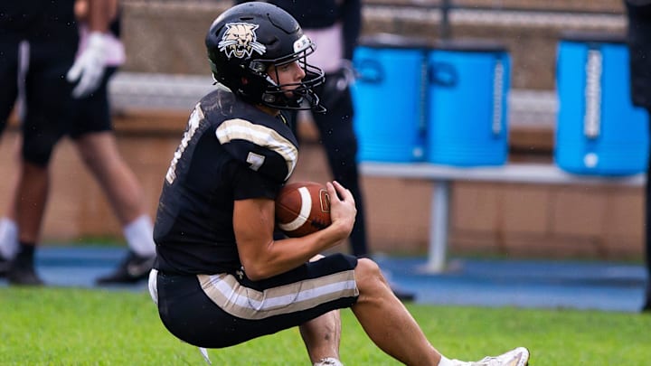 Buchholz Bobcats Keil Mcgriff (7) falls to the ground after catching a kickoff in the first half. The Buchholz Bobcats hosted the Gainesville High School Hurricanes at Citizens Field in Gainesville, FL on Monday, October 7, 2024. [Doug Engle/Ocala Star Banner]