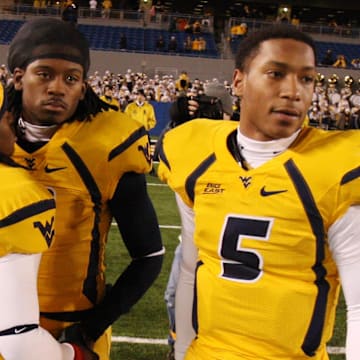 Dec 1, 2007, Morgantown, WV, USA; West Virginia Mountaineer quarterback (3) Markell Harrison defensive back (3) Larry Williams and quarterback Pat White after the Mountaineers 13-9 loss to the Pittsburgh Panthers at Mylan Puskar Stadium. Duhart recovered the fumble. Mandatory Credit: Bob Donnan-Imagn Images