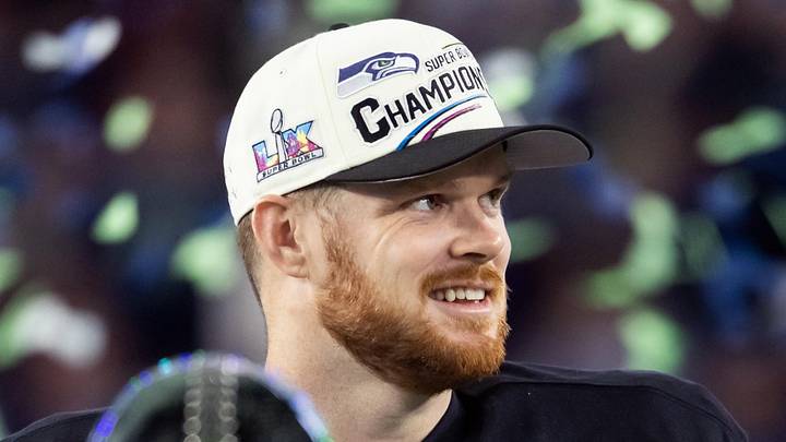 Seattle Seahawks quarterback Sam Darnold celebrates with the Vince Lombardi Trophy