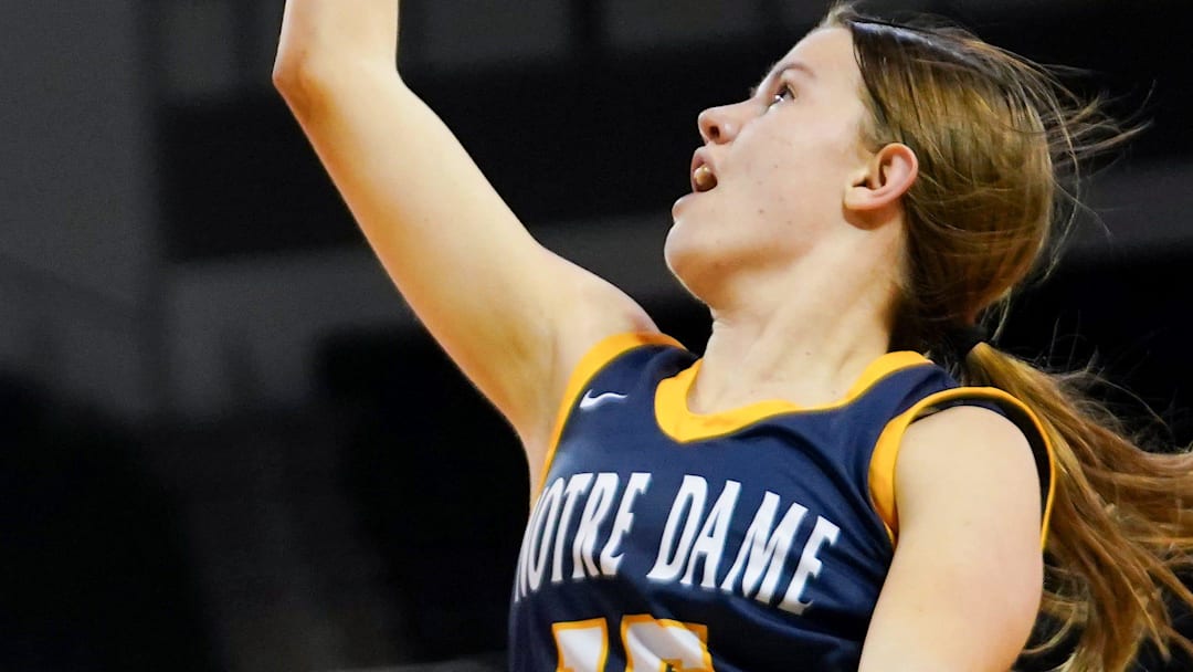 Notre Dame Academy Pandas guard Addie Lawrie (15) hits a layup in the second half of a Kentucky Ninth Region girls basketball final game between the Cooper Lady Jaguars and Notre Dame Academy Pandas, Friday, March 7, 2025, at Truist Arena in Highland Heights, Ky. Lady Jaguars won 60-57.