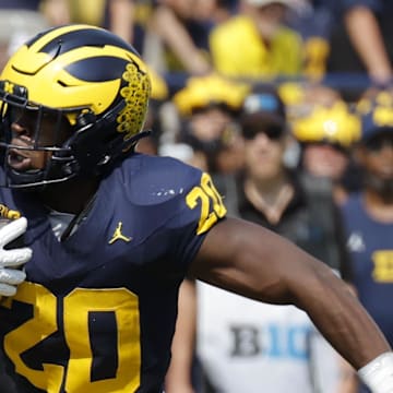 Sep 14, 2024; Ann Arbor, Michigan, USA;  Michigan Wolverines running back Kalel Mullings (20) runs the ball against the Arkansas State Red Wolves during the first half at Michigan Stadium. Mandatory Credit: Rick Osentoski-Imagn Images