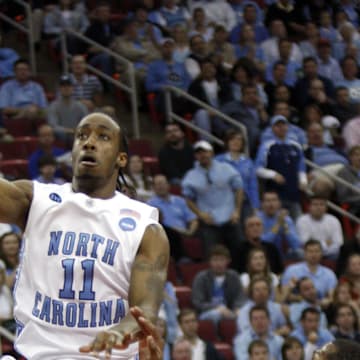 Mar 23, 2008; Raleigh, NC, USA; North Carolina Tar Heels guard Quentin Thomas (11) shoots as Arkansas Razorbacks guard Marcus Britt (12) defends in the first half in the 2nd round of the 2008 NCAA Mens Basketball Tournament at the RBC Center. 