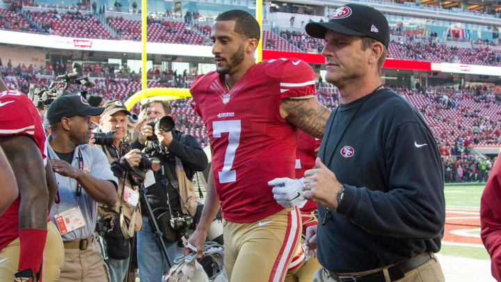 December 28, 2014; Santa Clara, CA, USA; San Francisco 49ers quarterback Colin Kaepernick (7) and head coach Jim Harbaugh (right) jog off the field after warm ups before the game against the Arizona Cardinals at Levi's Stadium. Mandatory Credit: Kyle Terada-USA TODAY Sports