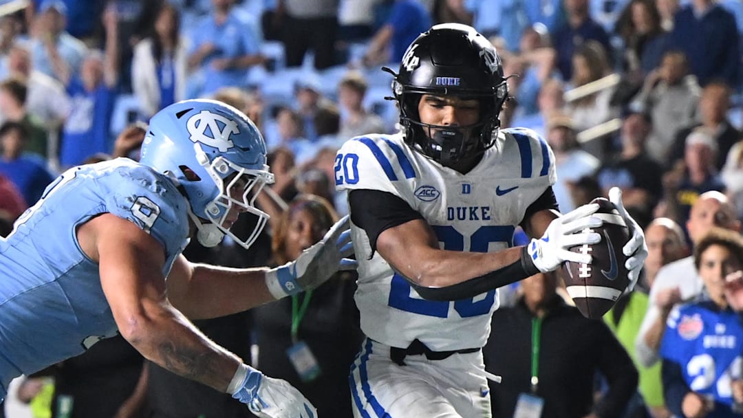 Nov 22, 2025; Chapel Hill, North Carolina, USA; Duke Blue Devils running back Nate Sheppard (20) scores during the second half at Kenan Stadium. Mandatory Credit: William Howard-Imagn Images
