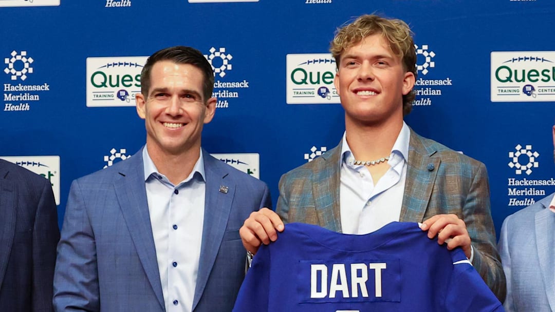 Apr 25, 2025; East Rutherford, NJ, US; New York Giants president John Mara (far left), general manager Joe Schoen (left), Jaxson Dart, and head coach Brian Daboll (right) pose for photos prior to the start of the press conference to introduce the Giants first round draft picks.  Mandatory Credit: Thomas Salus-Imagn Images